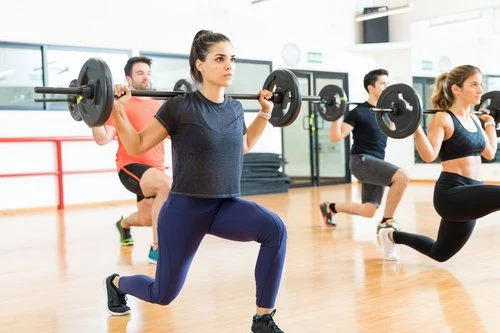 Strength Training classes with ladies lunging